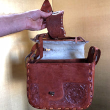 Load image into Gallery viewer, A VINTAGE TOOLED LEATHER SADDLE BAG FROM MEXICO