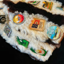Load image into Gallery viewer, A 1980s KANGAROO SKIN POUCH DECORATED WITH TOURIST BADGES FROM THE N.T.