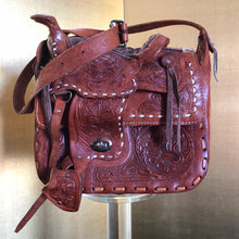 Load image into Gallery viewer, A VINTAGE TOOLED LEATHER SADDLE BAG FROM MEXICO