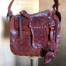 Load image into Gallery viewer, A VINTAGE TOOLED LEATHER SADDLE BAG FROM MEXICO