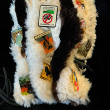 Load image into Gallery viewer, A 1980s KANGAROO SKIN POUCH DECORATED WITH TOURIST BADGES FROM THE N.T.