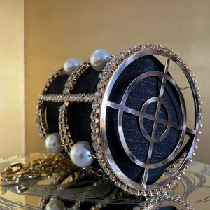 A RHINESTONE CAGE BAG WITH GIANT PEARLS
