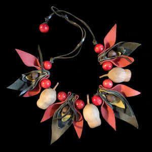 AN 80s GUM NUT NECKLACE WITH RED BEADS