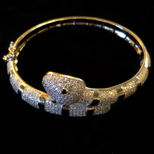 Load image into Gallery viewer, A GOLD TONE BANDED DIAMANTÉ SNAKE BRACELET
