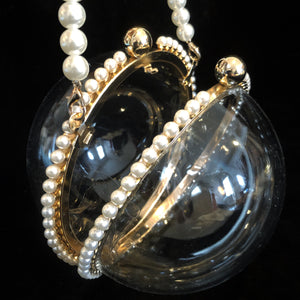 A PERSPEX SPHERICAL EVENING BAG WITH PEARLS