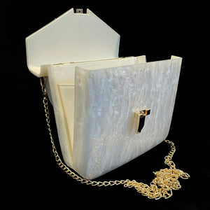 A MARBLED LUCITE MINI ATTACHÉ WITH GOLD FITTINGS