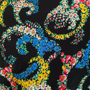 A LARGE 1920s FLORAL SHAWL WITH BLACK BORDERS