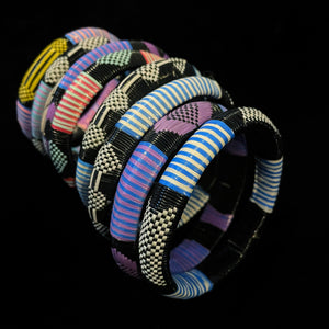 A COLLECTION OF NINE BURKINA FASO AFRICAN BANGLES