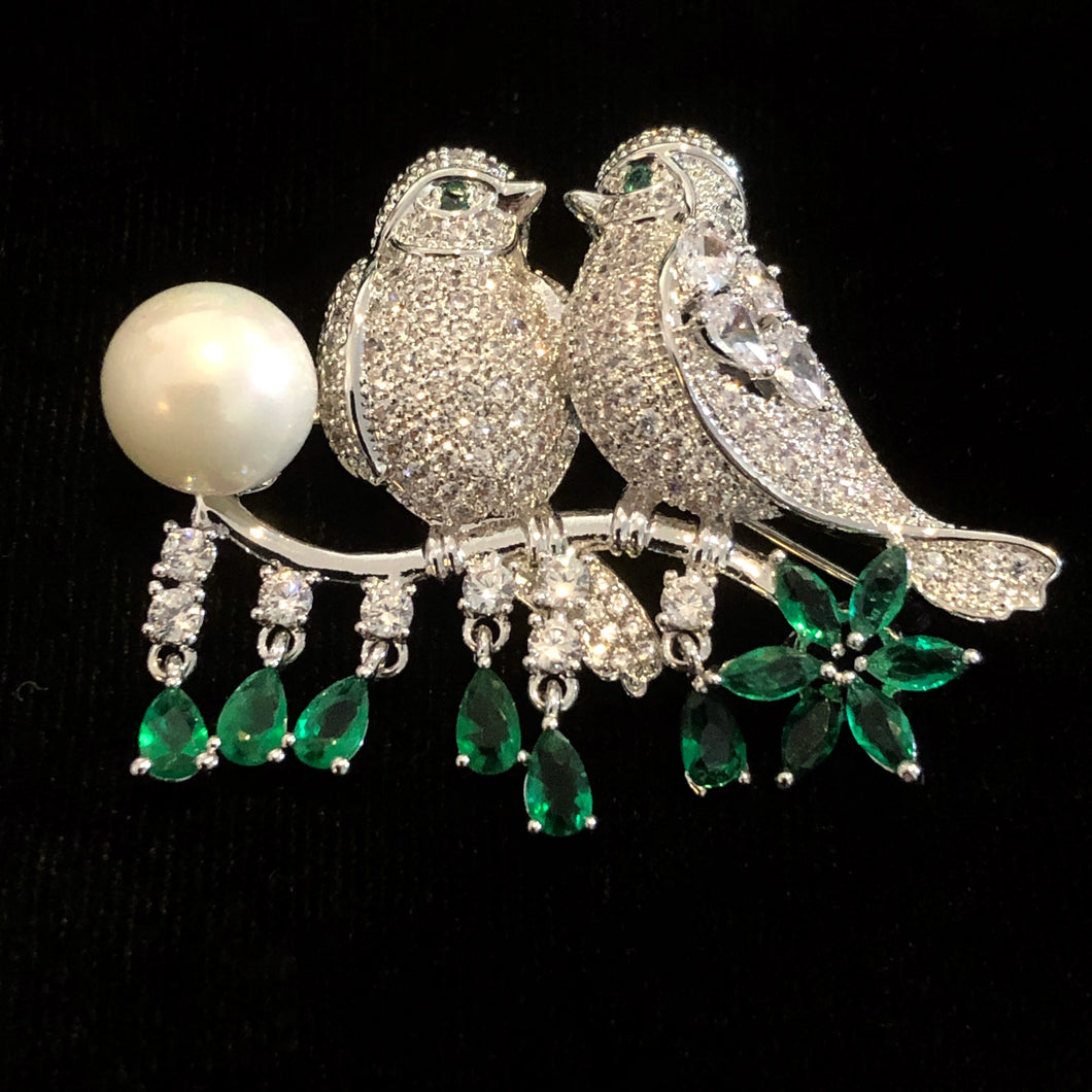 TWO BIRDS ON A BRANCH BROOCH WITH SINGLE PEARL