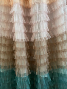 AN EXTRAVAGANT TIERED RUFFLED SKIRT IN PASTEL COLOURS.