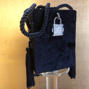 A BLACK FLOCKED EVENING CASE WITH TASSELS