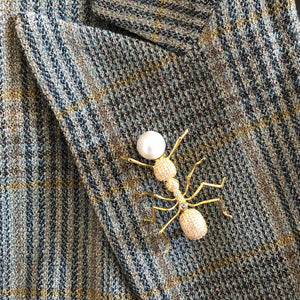 AN ANT BROOCH WITH PEARL EGG
