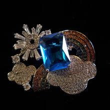 Load image into Gallery viewer, A PETITE DIAMANTÉ WEATHER BROOCH WITH BLUE JEWEL
