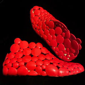 A PAIR OF GAETANO PESCE FOR MELISSA RED RUBBER SHOES