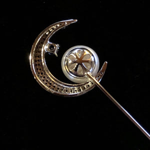 A CRESCENT MOON AND PEARL TIE PIN