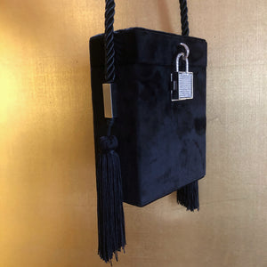 A BLACK FLOCKED EVENING CASE WITH TASSELS