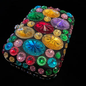 AN EVENING CLUTCH WITH MULTICOLOURED PLASTIC JEWELS.