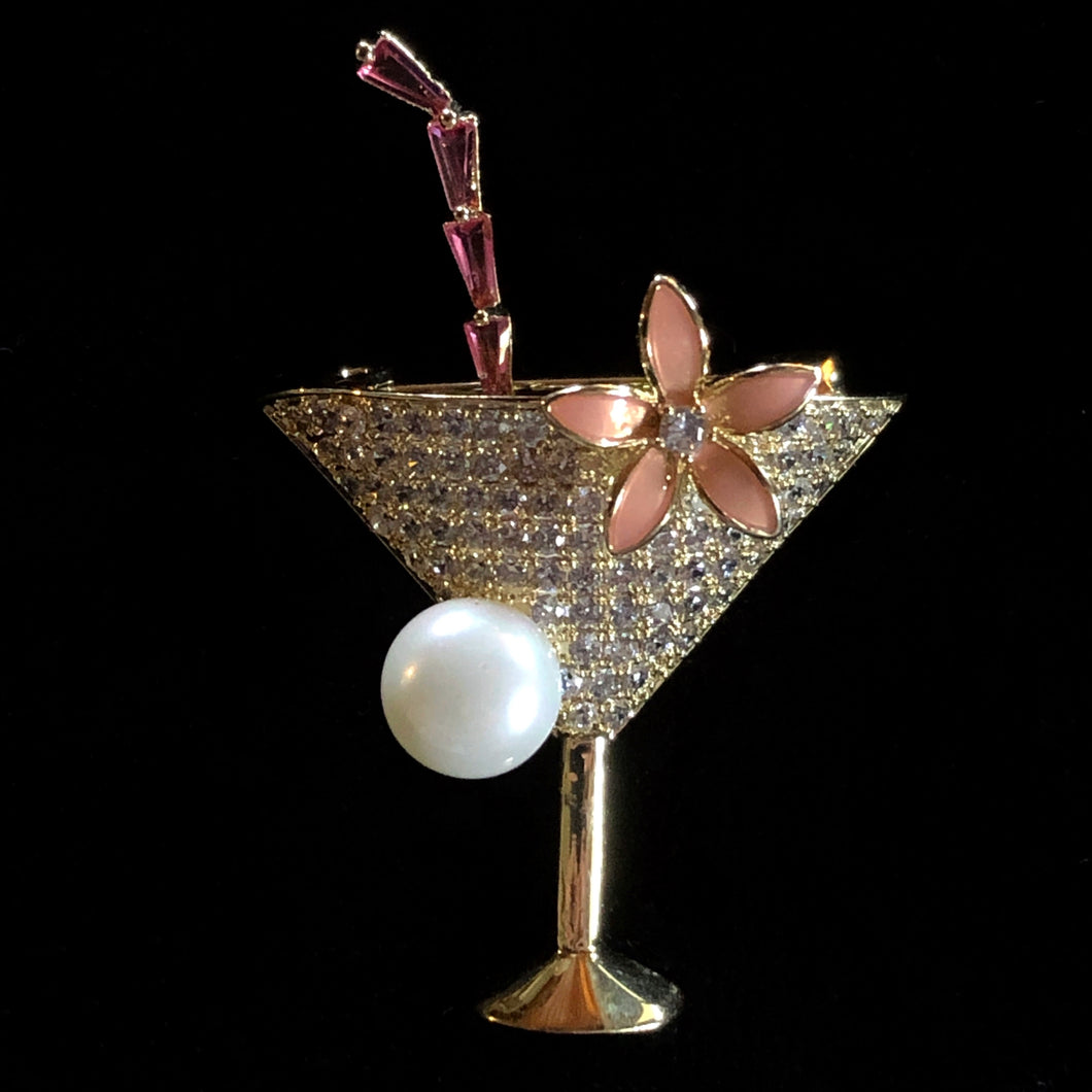 A CHAMPAGNE COCKTAIL BROOCH WITH PEARL