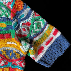 AN EARLY, 1980s COOGI COTTON SHORT SLEEVED JUMPER