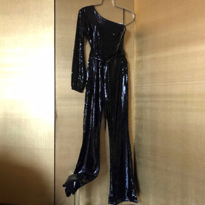 A ONE ARMED BLACK SEQUINNED JUMPSUIT
