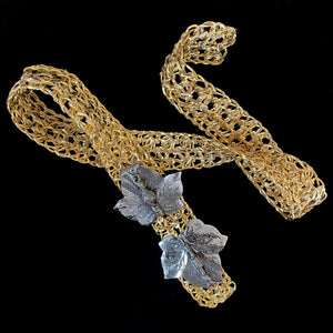 A 1970s GOLD METAL WEAVE BELT WITH RHODIUM LEAF BUCKLE