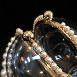 A PERSPEX SPHERICAL EVENING BAG WITH PEARLS