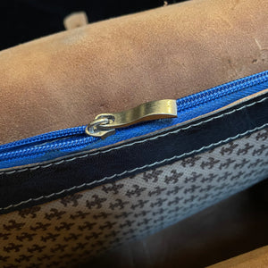 A HAND CRAFTED WESTERN STYLE STUDDED BAG WITH BLUE JEWEL